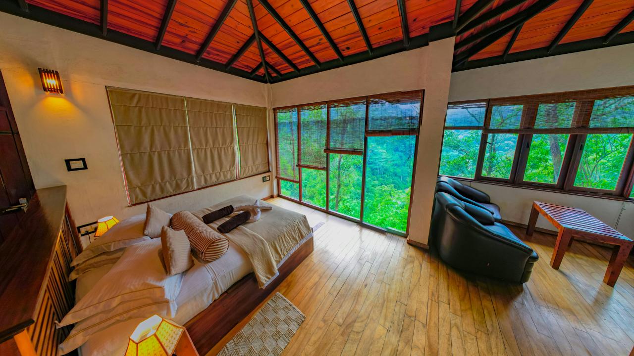 a bedroom with a bed and a tv in it